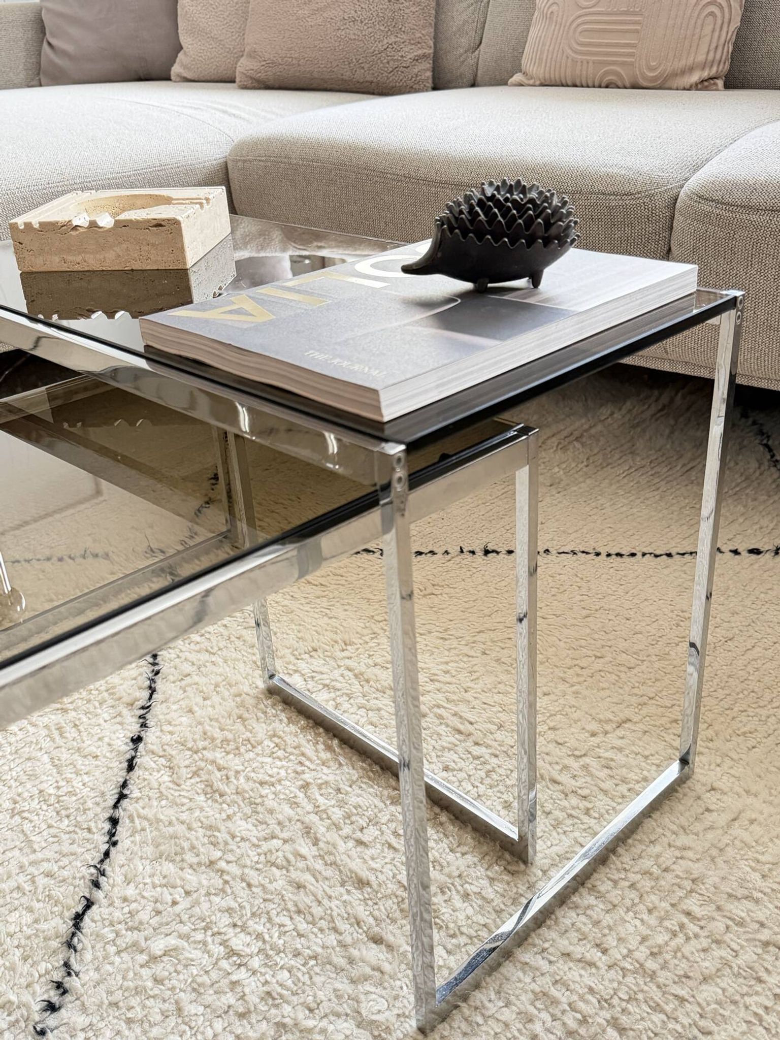 Set of 2 vintage nesting coffee tables in chrome metal and smoked glass.