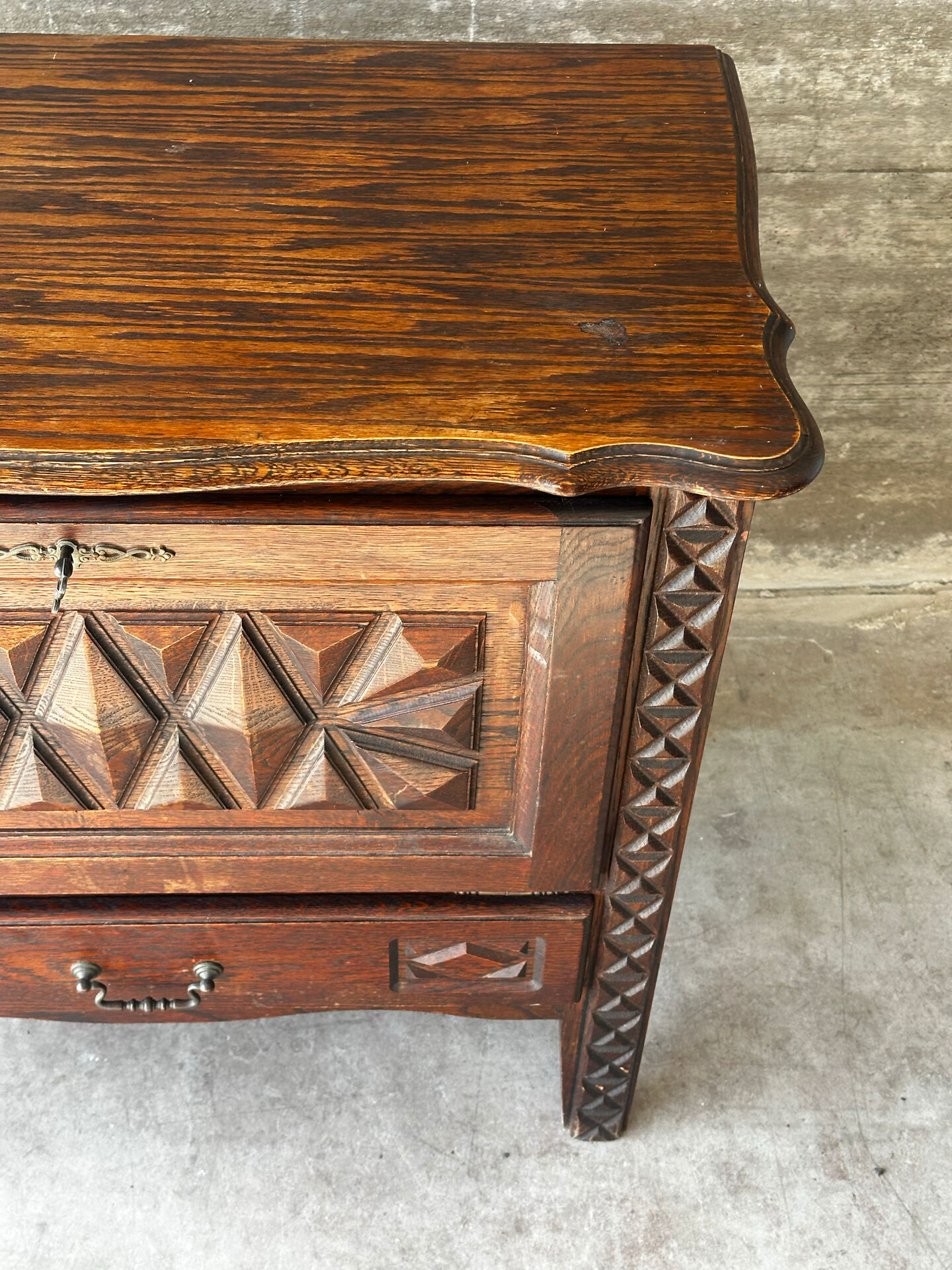 Small storage cabinet in carved oak – circa 1930