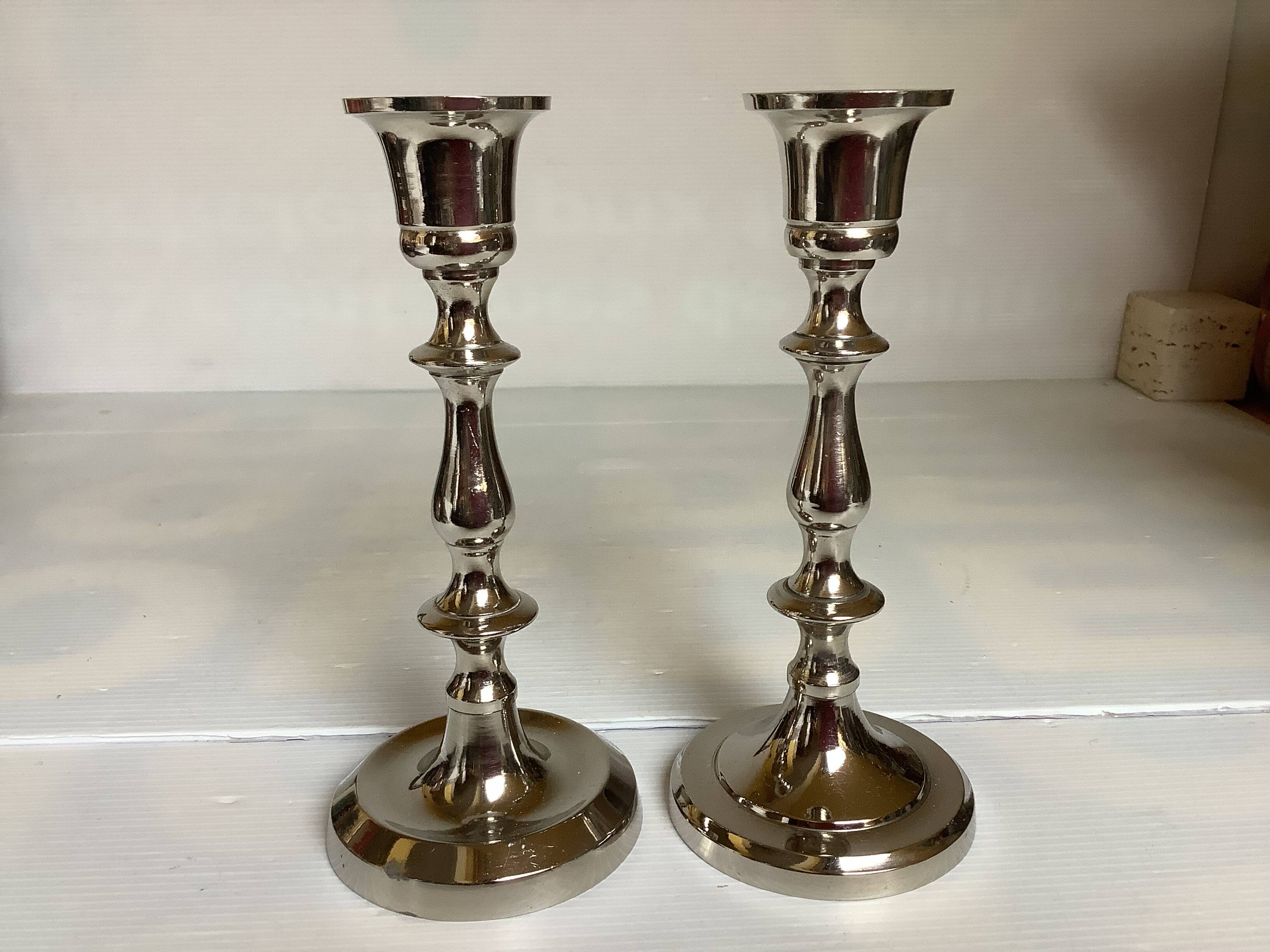 Pair of silver metal candlesticks