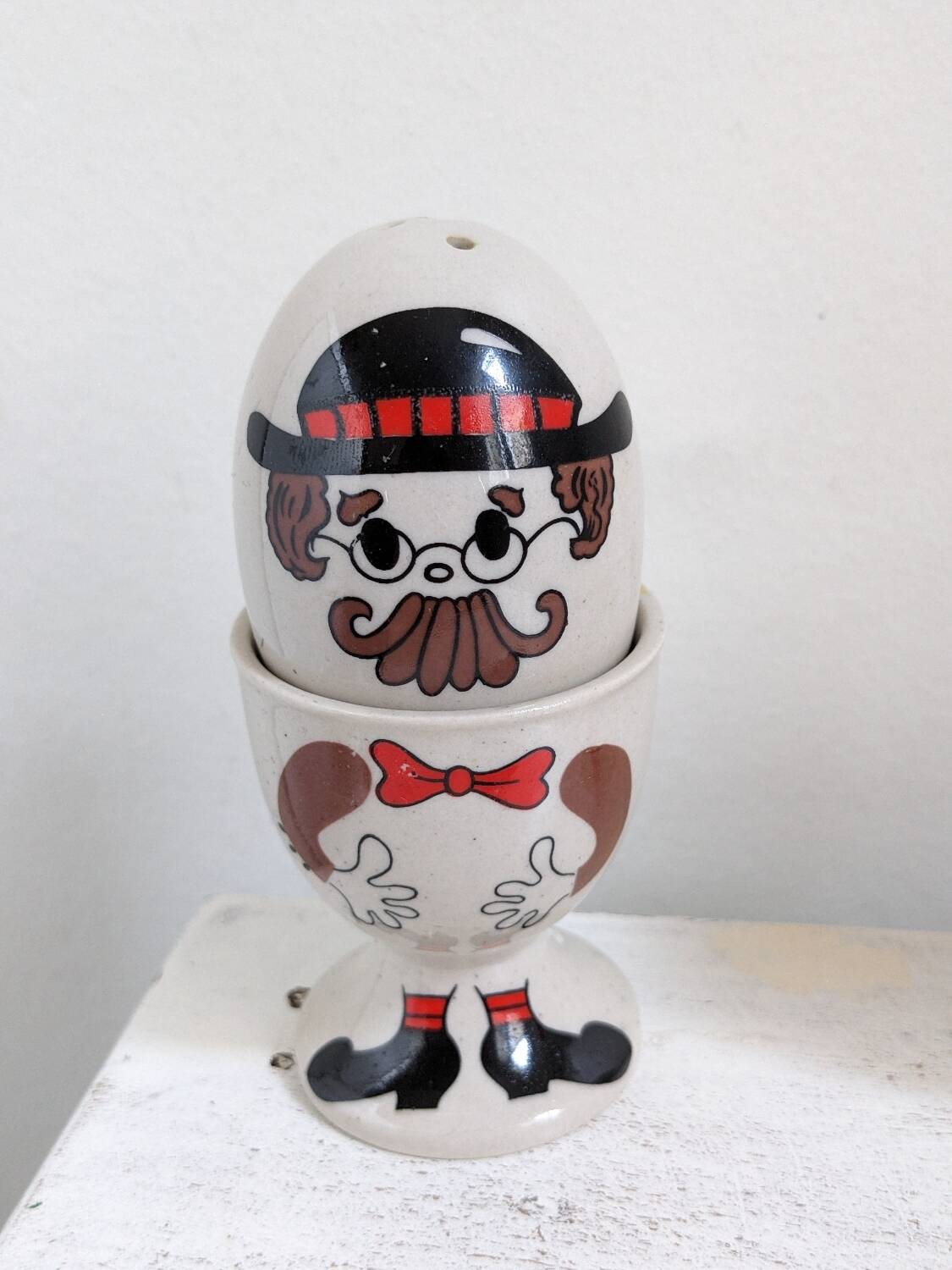 Egg cup, salt and pepper shaker duo