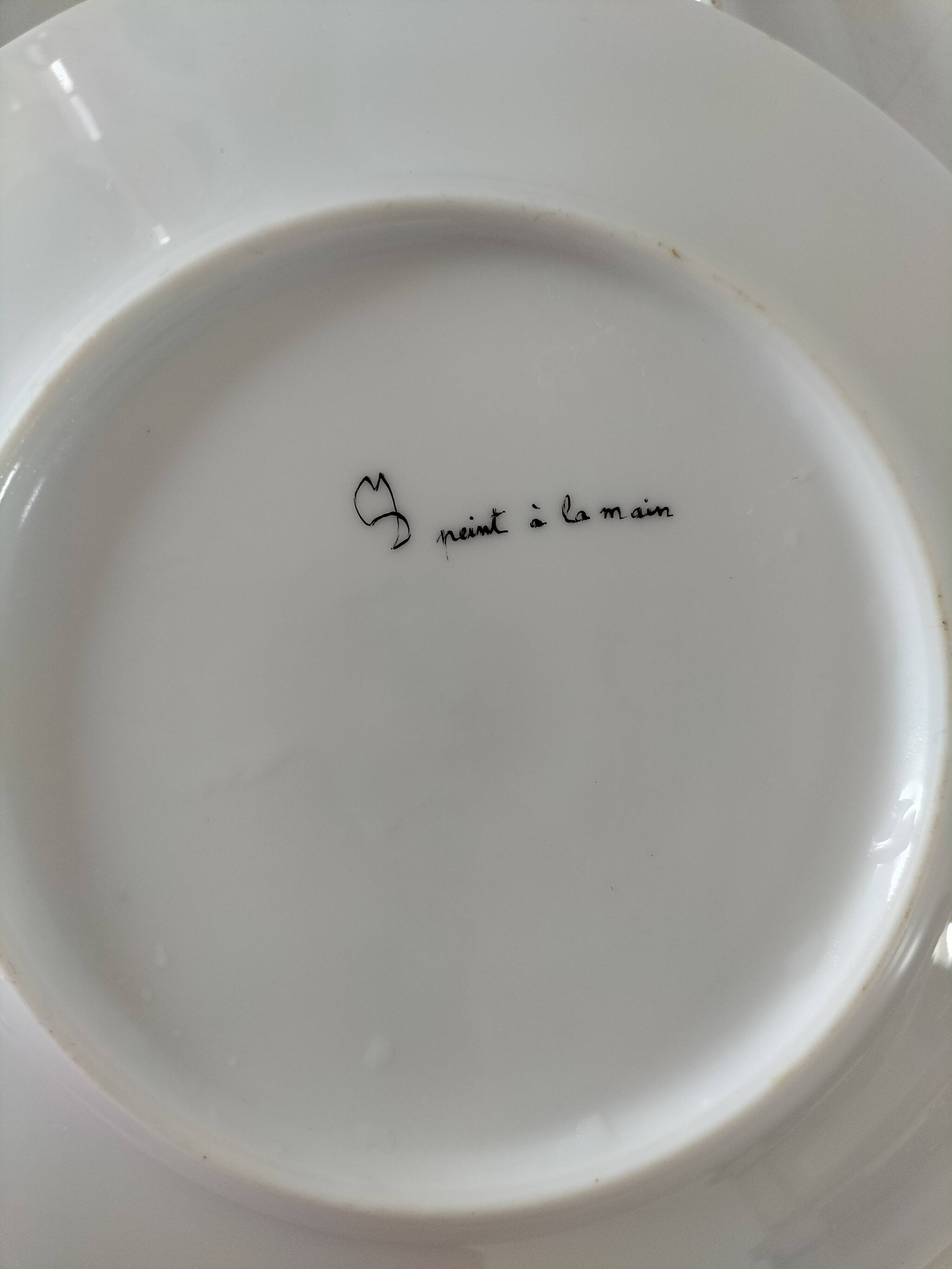 5 hand-painted dessert plates with stylised fruit designs.