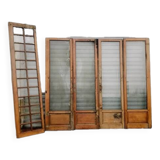 Suite de quatre portes de séparation en chêne massif XXe siècle
