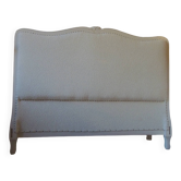 Louis XV style headboard with pearl grey patina, upholstered in off-white bouclette.