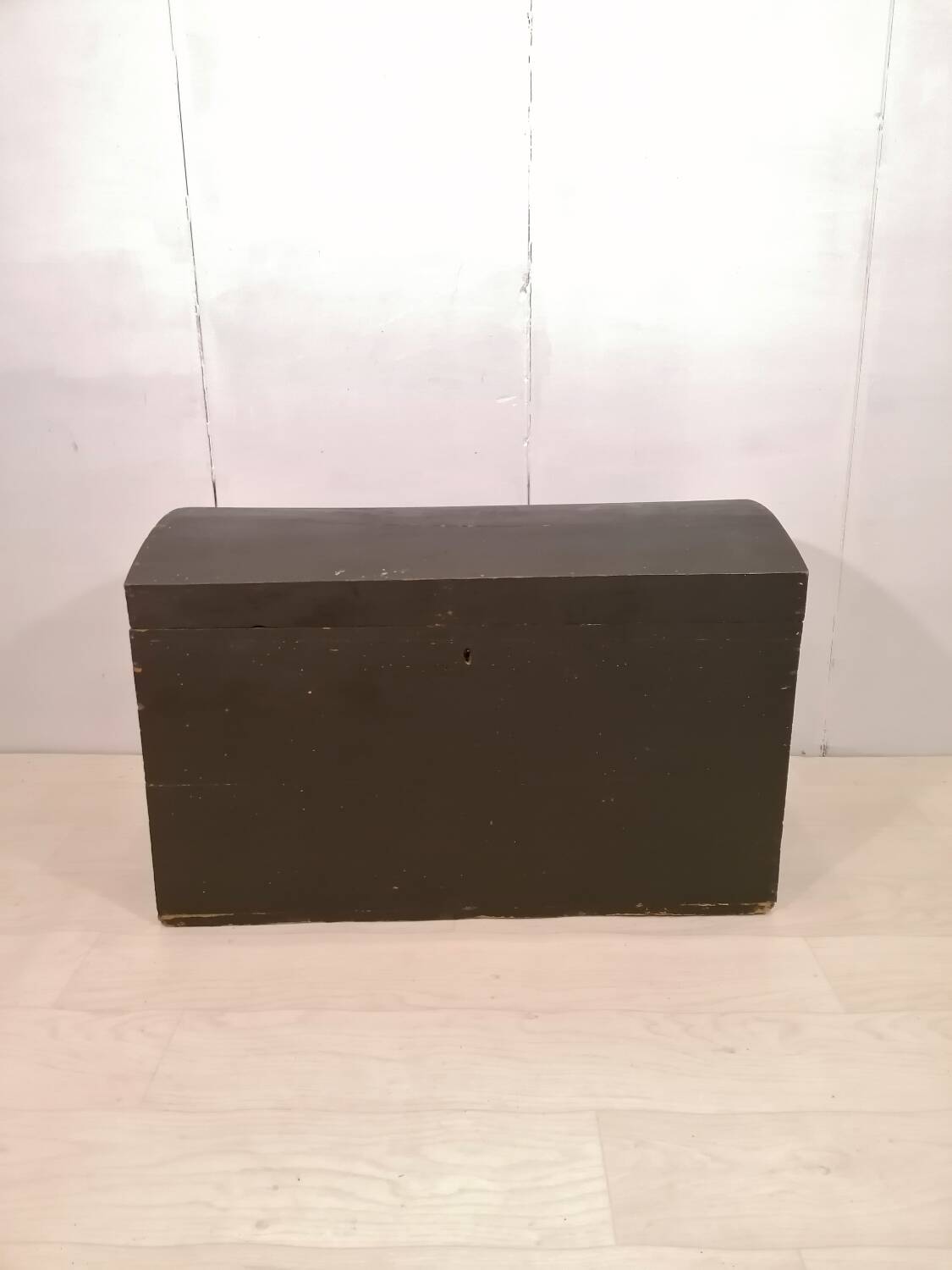 Large travel trunk in blackened wood