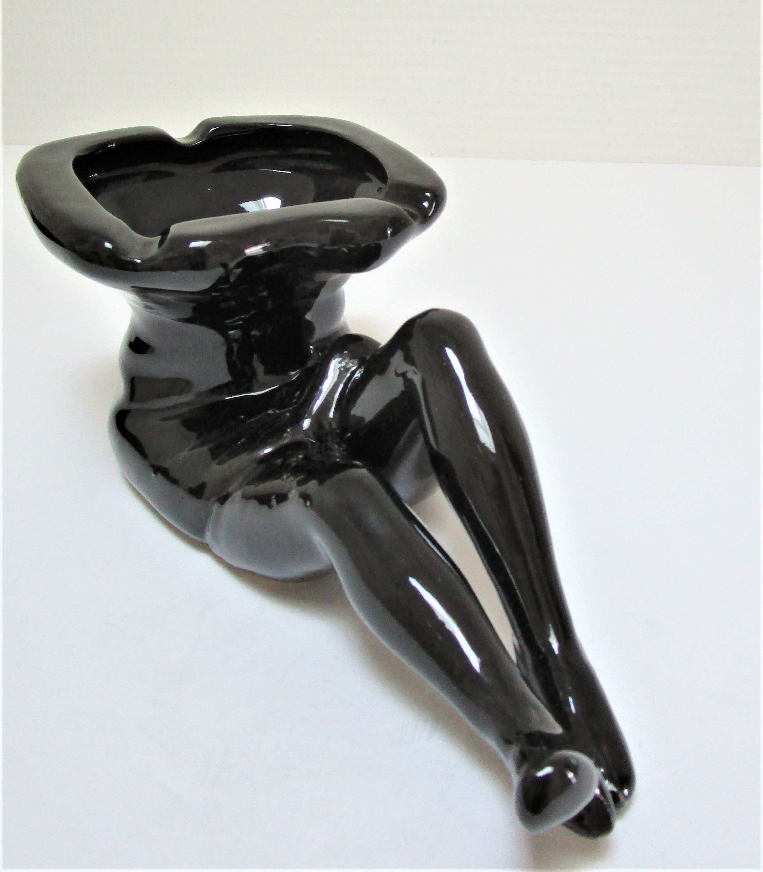 Anthropomorphic ashtray legs ceramic black design 80s