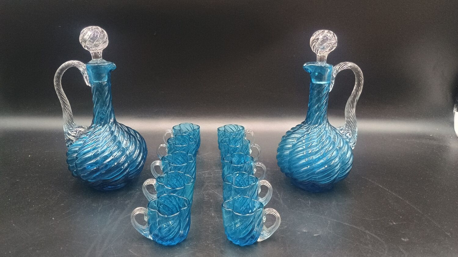 Cabaret Portieux liqueur service with 10 blue and clear glasses.