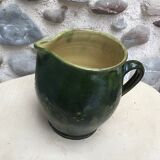 Green varnished earth pitcher with flower pattern