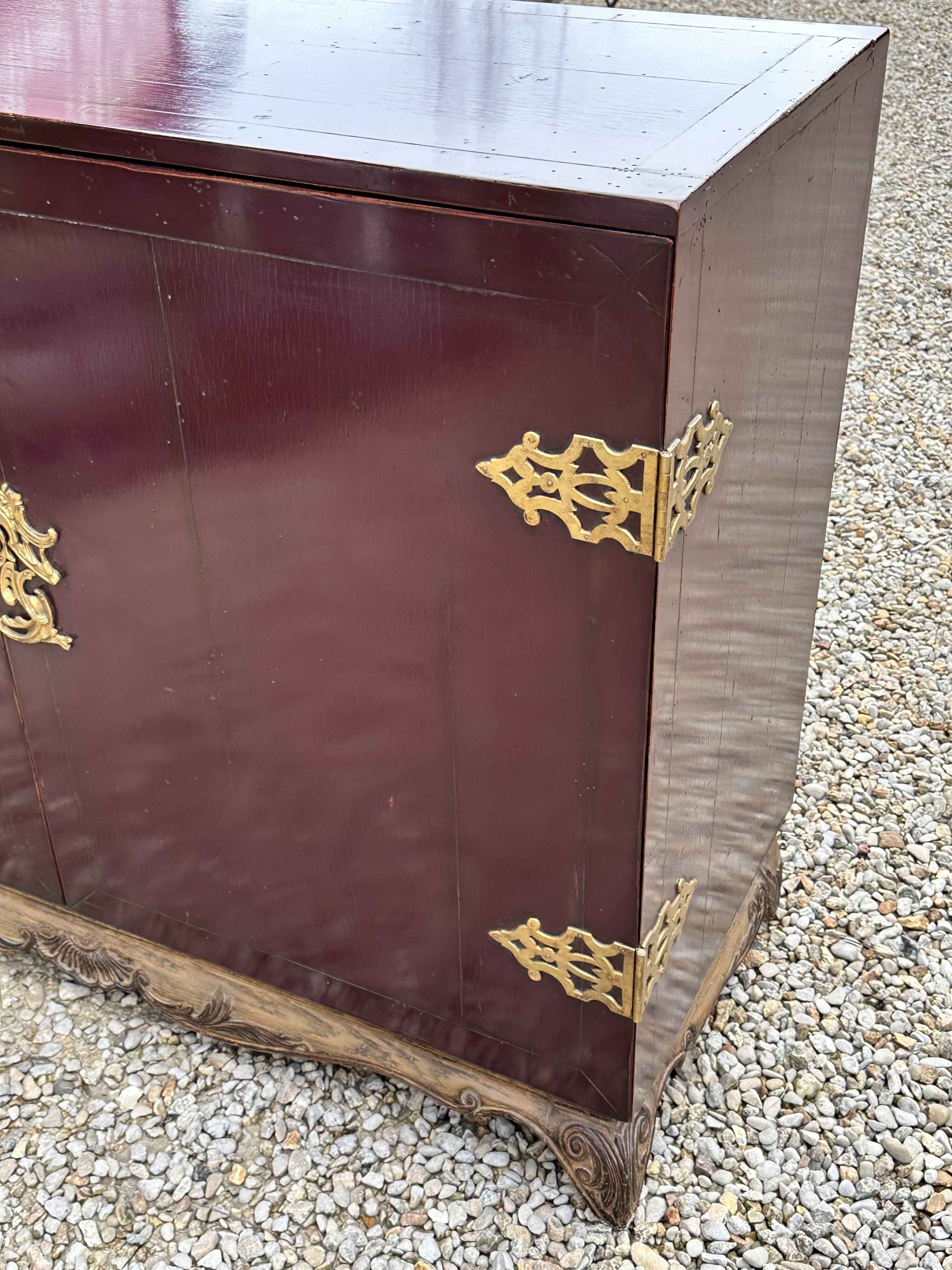 1950's lacquered wood and brass sideboard