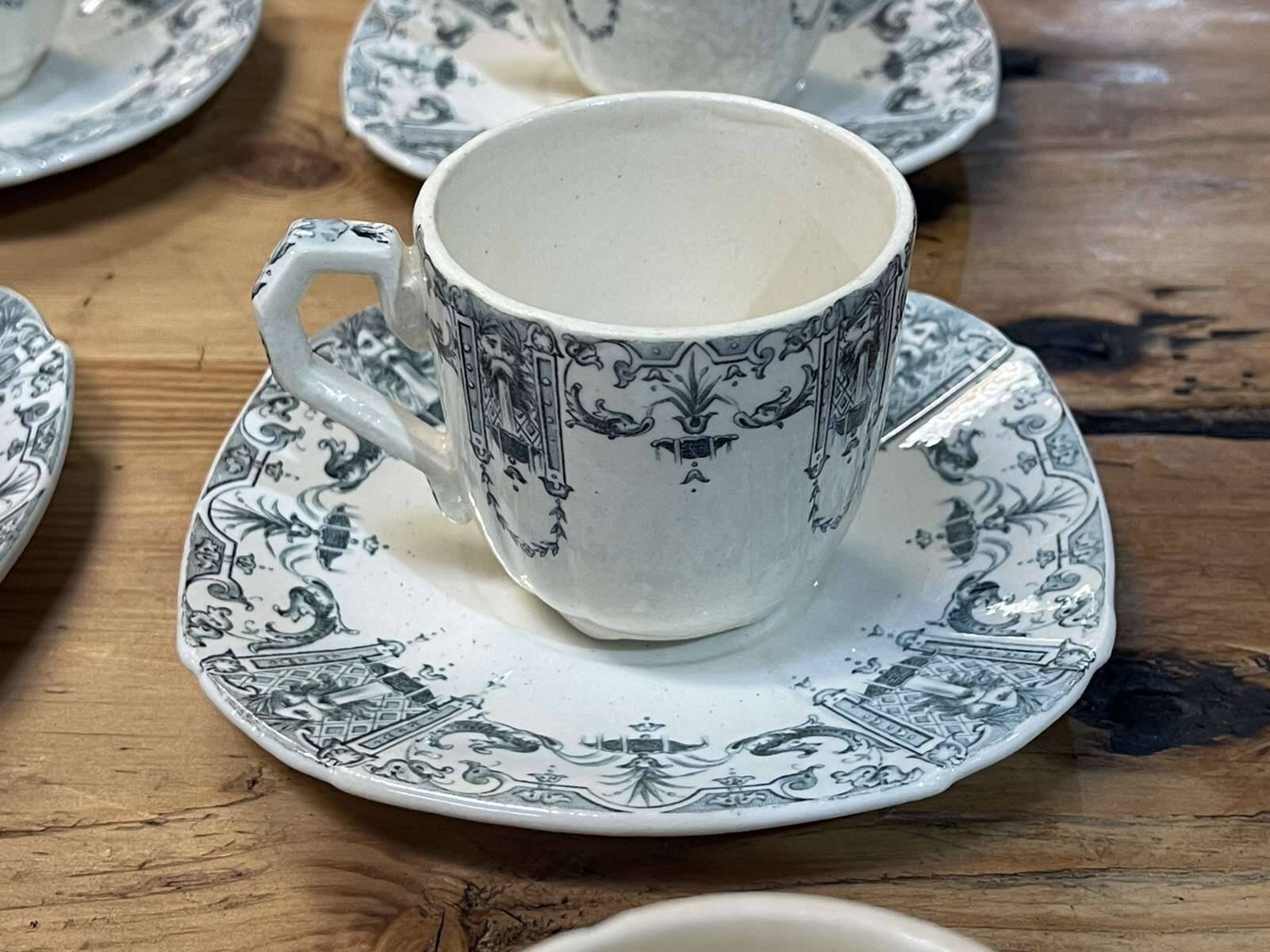 6 cups and saucers in Gien earthenware with Mascaron decoration from the early 20th century.