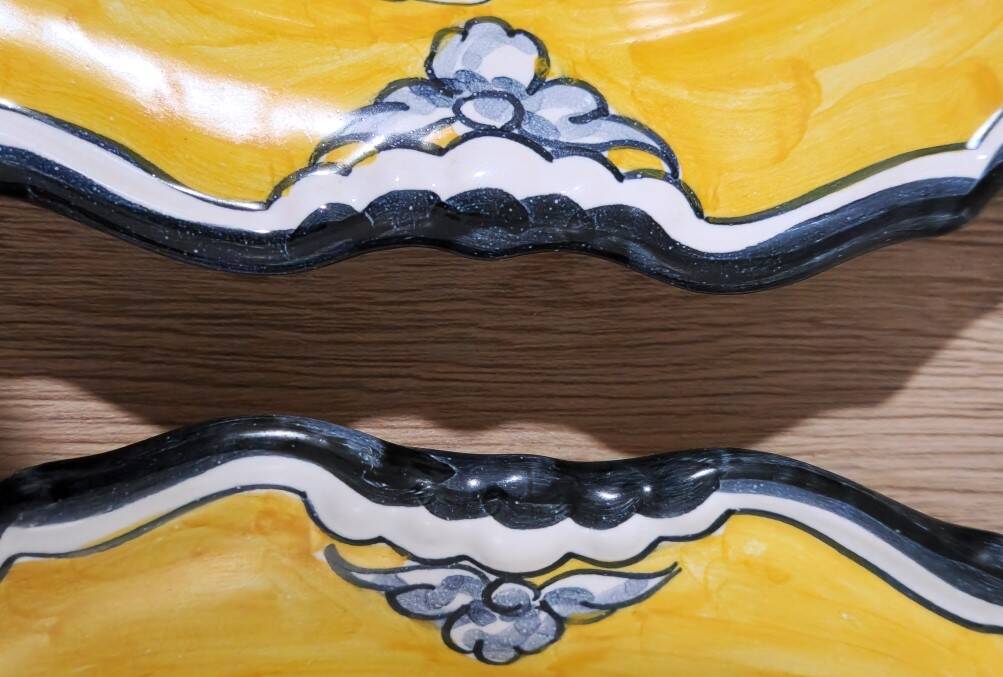 Pair of oval dishes in hand-painted faience with an Italian majolica spirit.