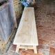 Rustic, raw solid oak bench.
