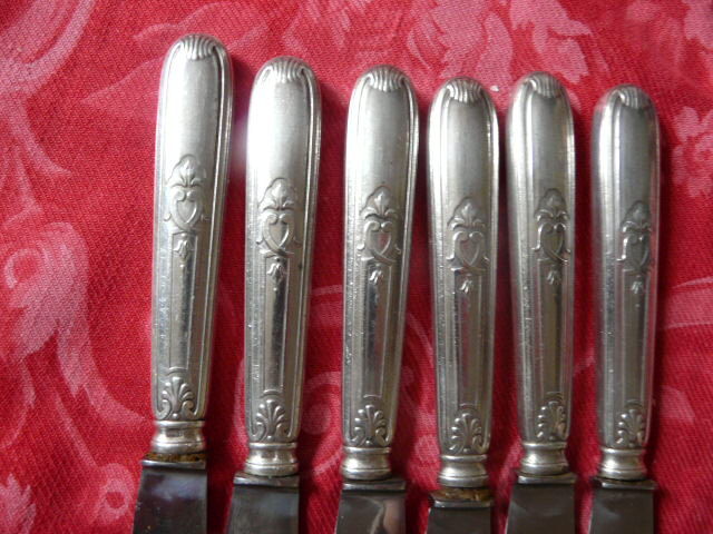 Series of 12 antique silver metal knives in their box
