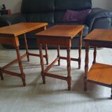 Nesting tables in solid cherry wood held together by slides