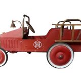 Old fire car with pedals, made of sheet metal.