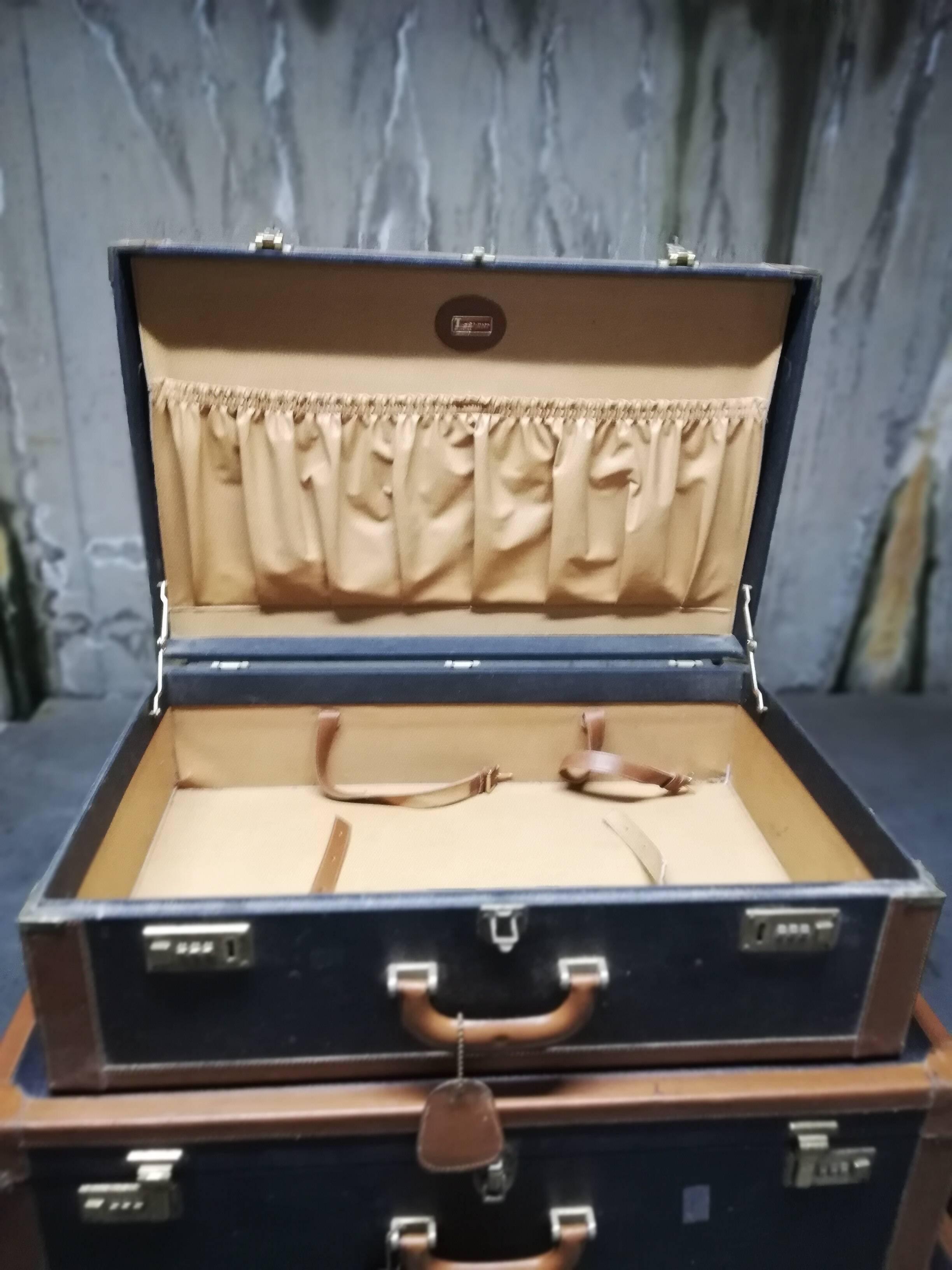 Pull-out leather and moleskine suitcases 1960