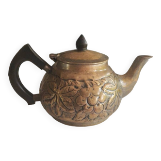 Antique decorative bronze teapot with vine leaf motifs