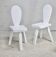 Pair of tripod chairs, gouged seats. Brutalist, circa 1960. Painted wood.