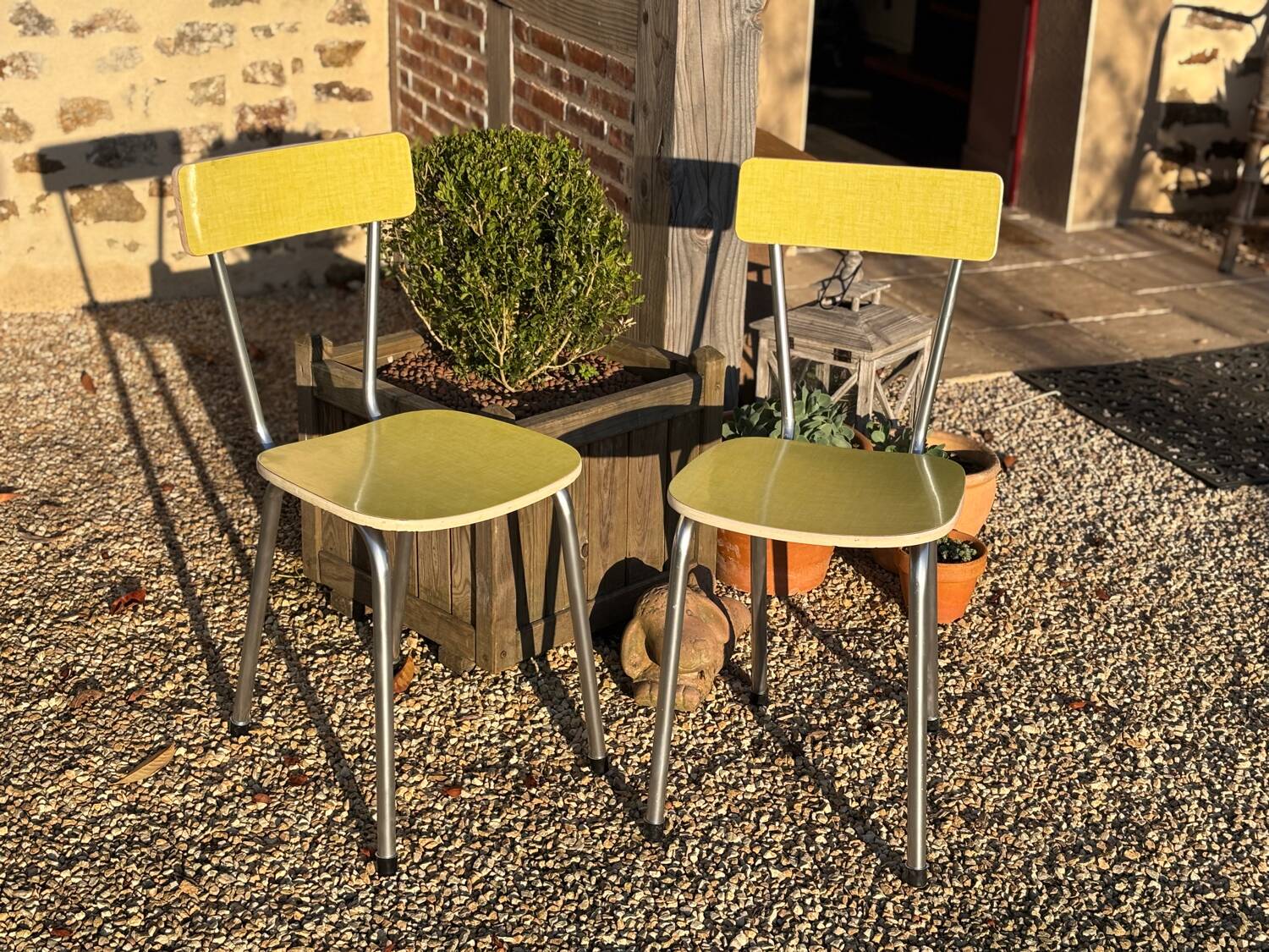 Pair of yellow Formica chairs