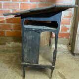 Antique writing desk, blackened wooden filing cabinet.