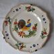 Decorative plate in earthenware with rooster design. Late 19th century.