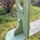 Old curved wooden farm bench