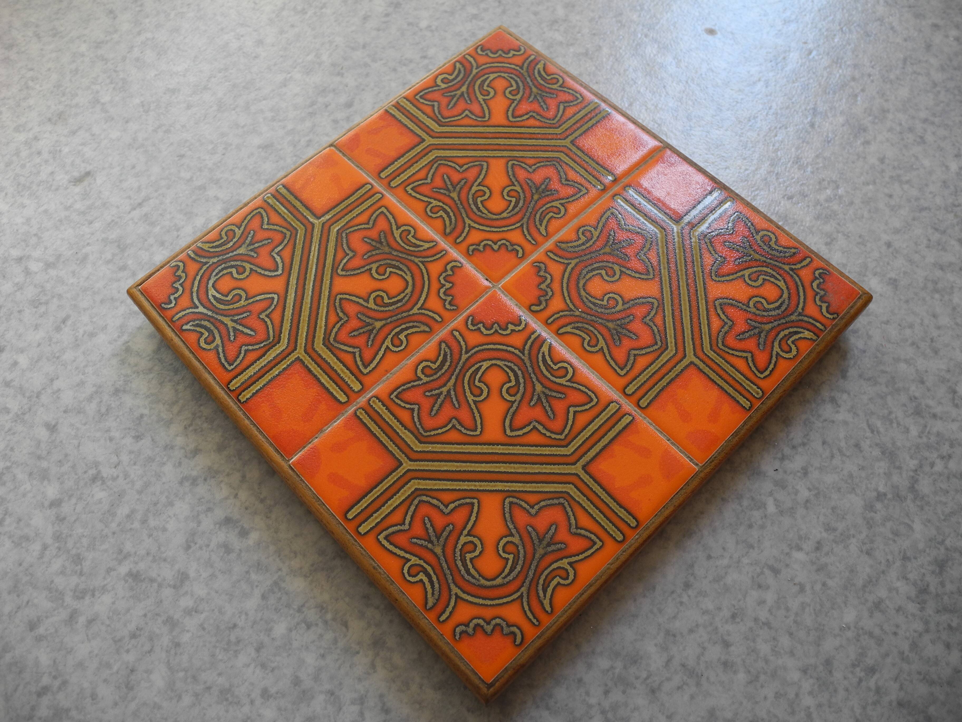 old orange earthenware trivet vintage decor art table 70s