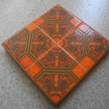 Dessous de plat ancien en faïence orange vintage