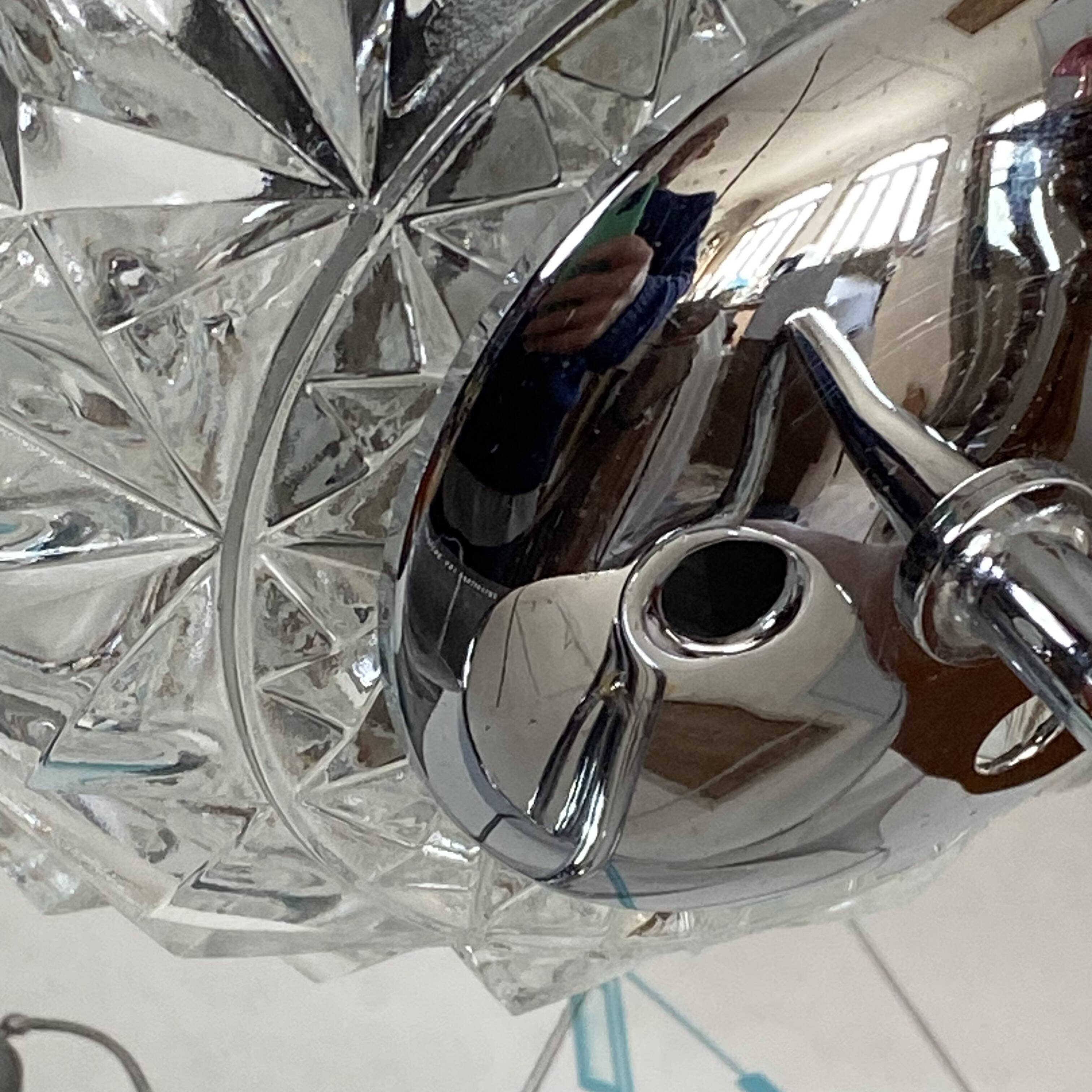 Swan neck wall light in stainless steel, thick glass shade, stainless steel rose.