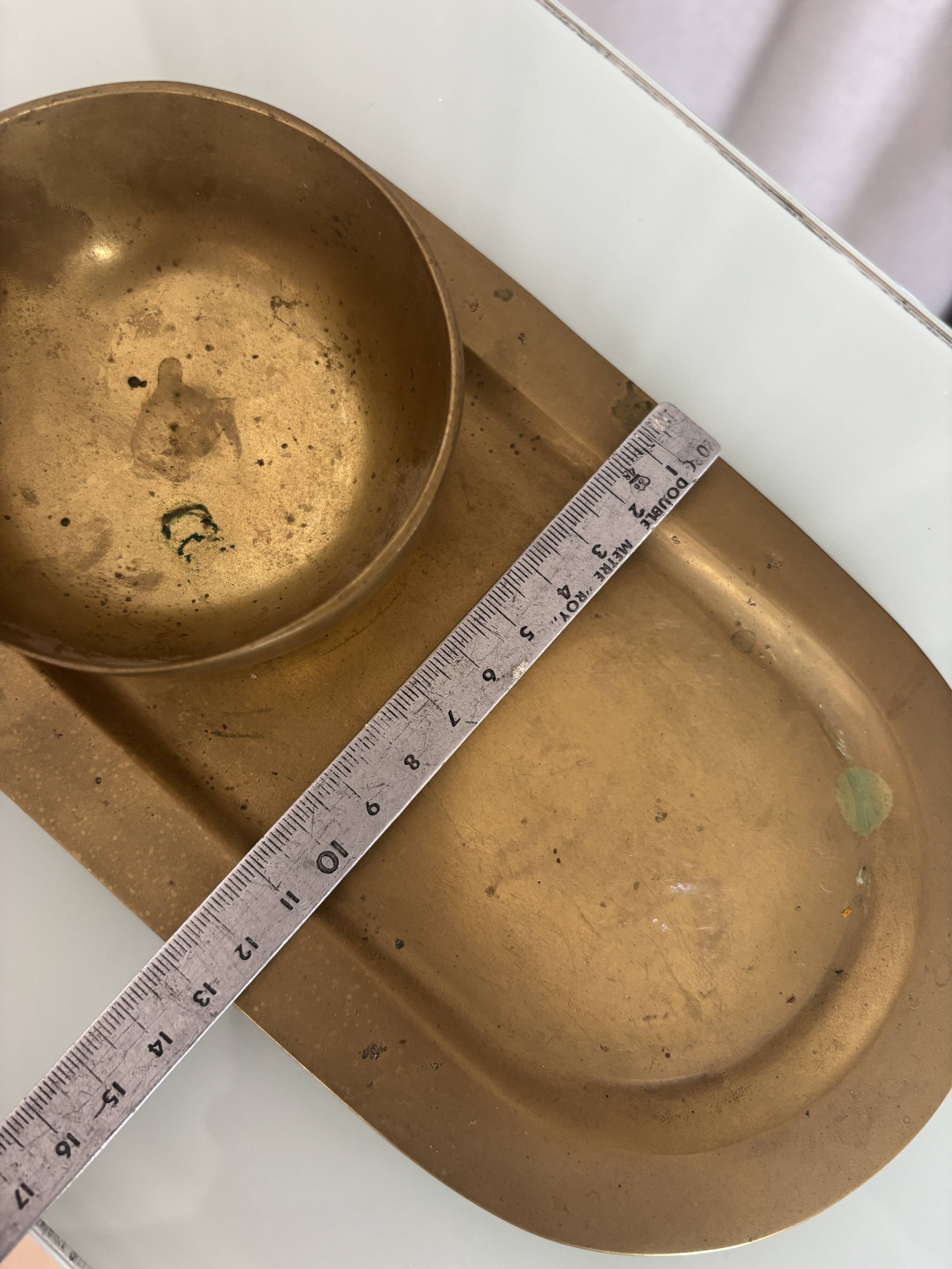 Empty pocket ensemble and bowl in solid brass signed Giò Lanciani.