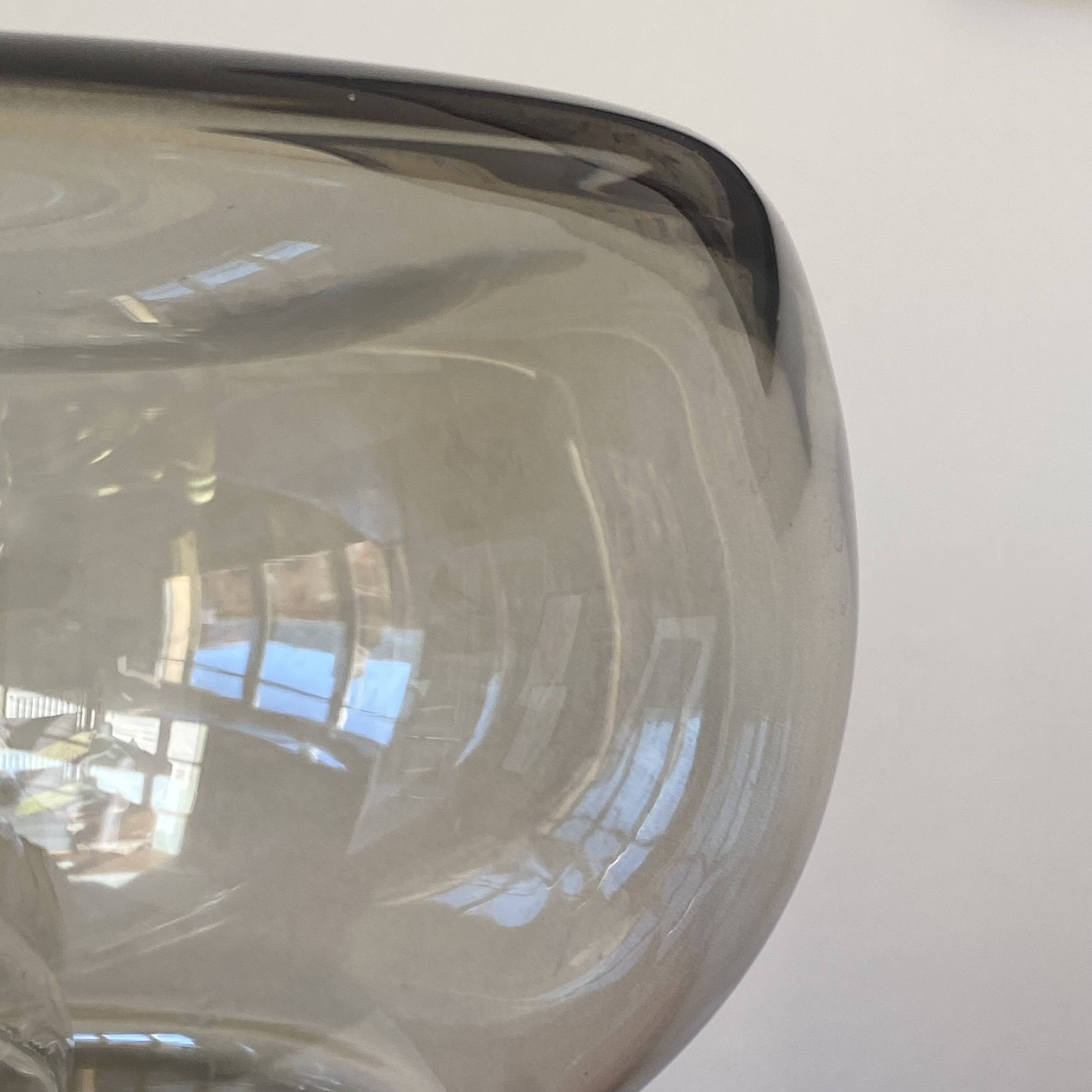 Sciolari table lamp with smoked glass globe and black plastic base.