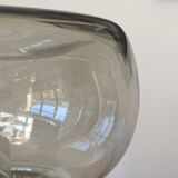 Sciolari table lamp with smoked glass globe and black plastic base.