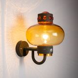 Pair of brass wall lamps with decorated amber coloured shades