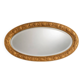 Vintage gold oval mirror with floral decoration.