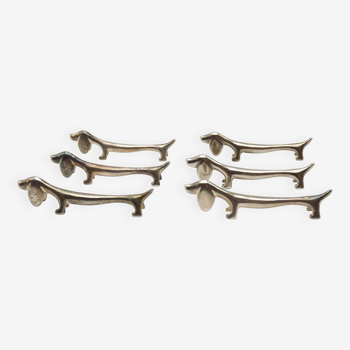 A delightful set of 6 French vintage cutlery rests in the shape of a elongated Dachshund Dog.   Here