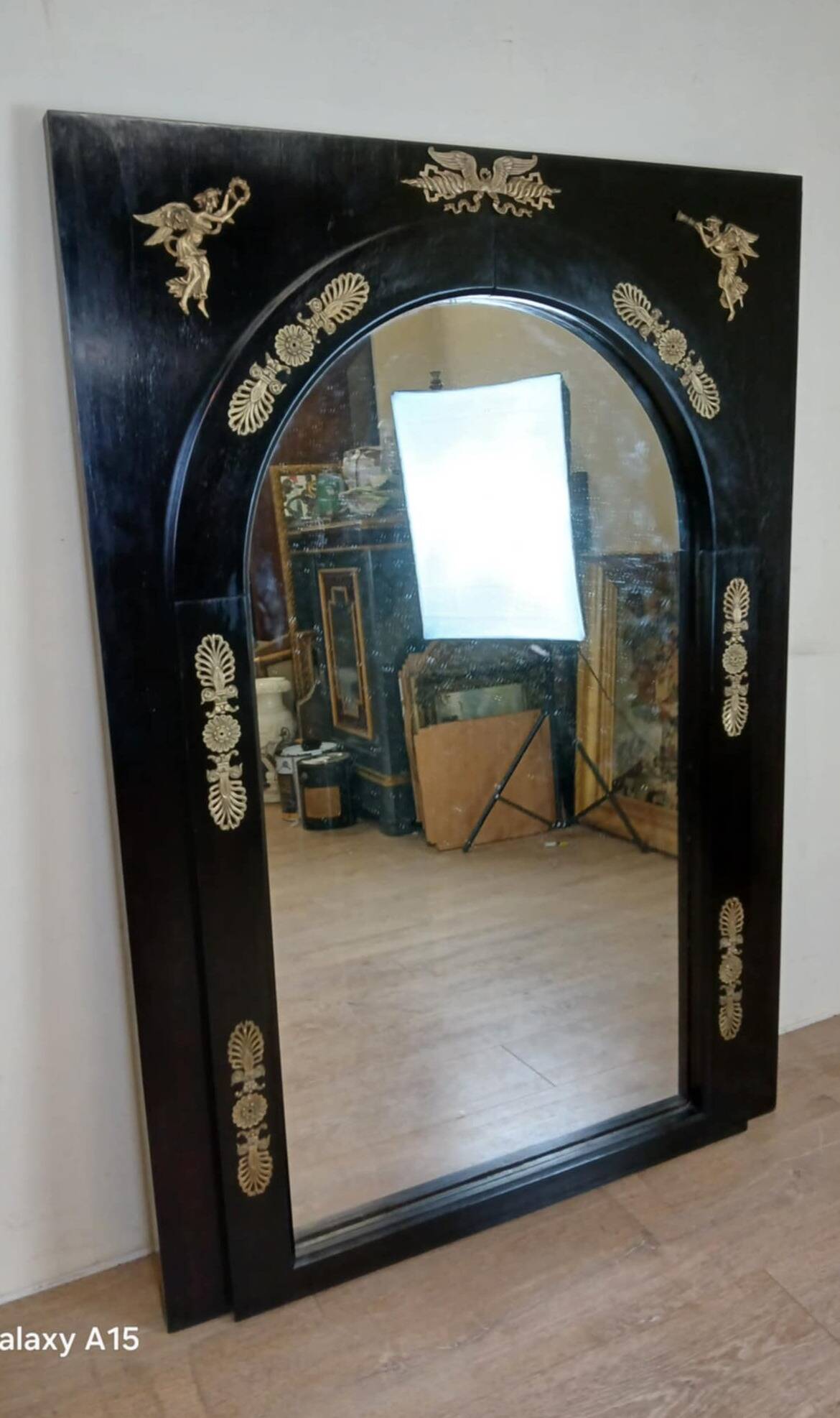Miroir Empire en bois laqué noir et bronze doré époque XIXeme