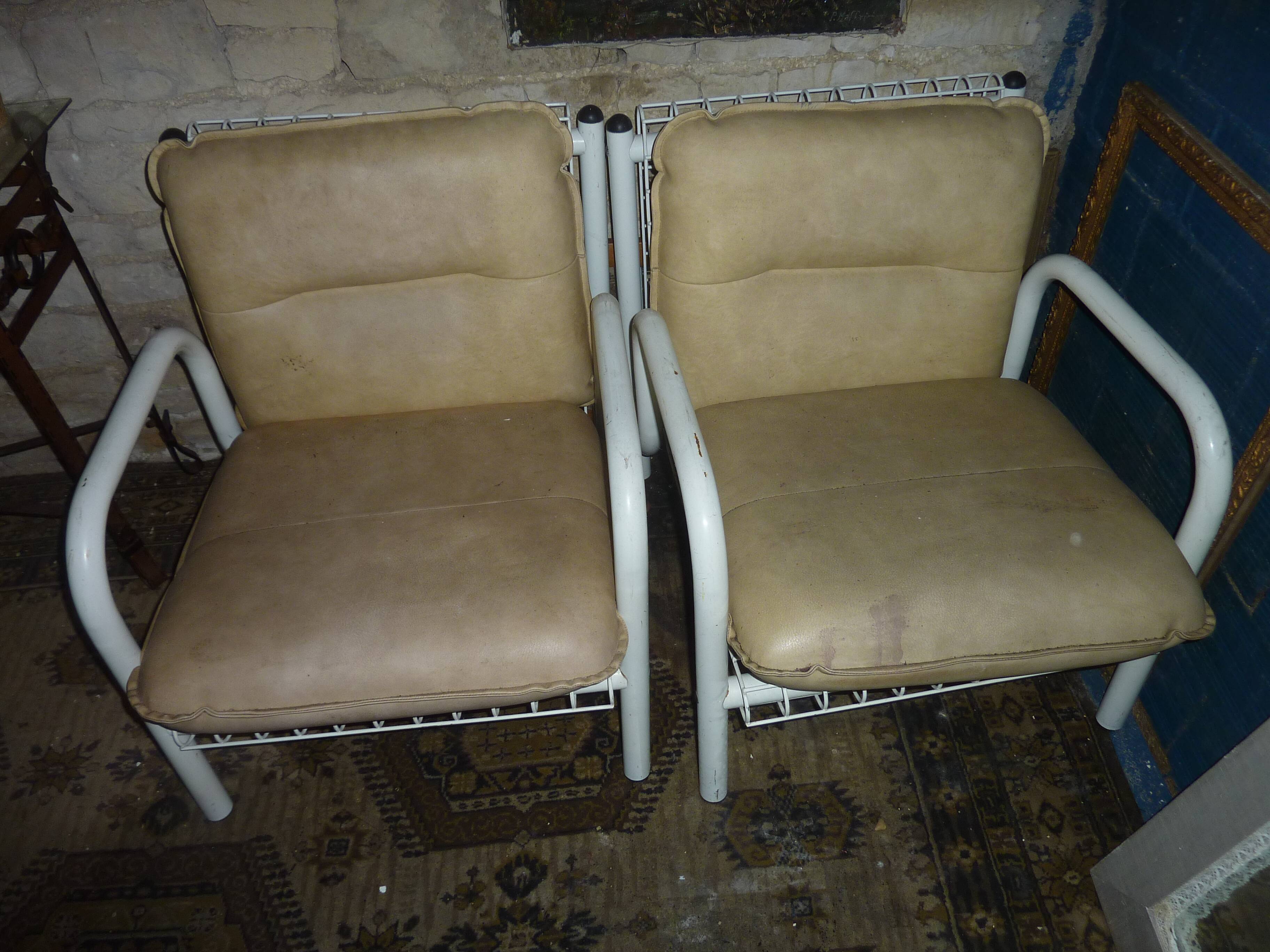 pair of iron armchairs