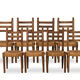 Ensemble de 8 chaises paillées en chêne. Années 1950.