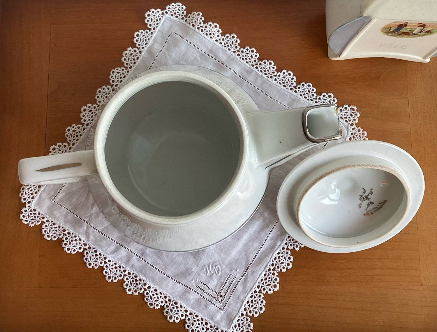 Antique porcelain coffee pot with stamped fire