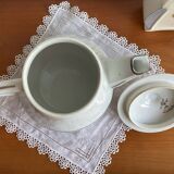 Antique porcelain coffee pot with stamped fire