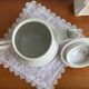 Antique porcelain coffee pot with stamped fire