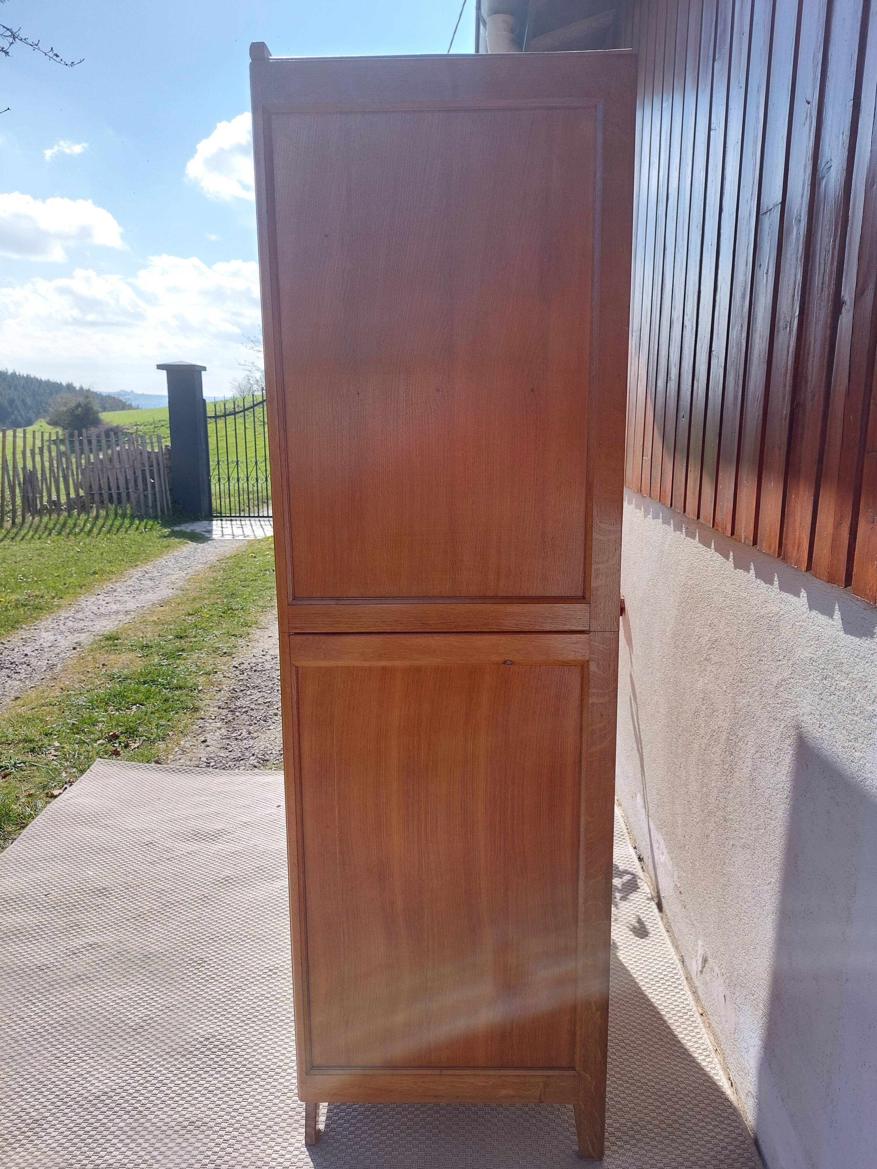 Vintage wardrobe with mirror and tapered legs.