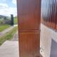 Vintage wardrobe with mirror and tapered legs.