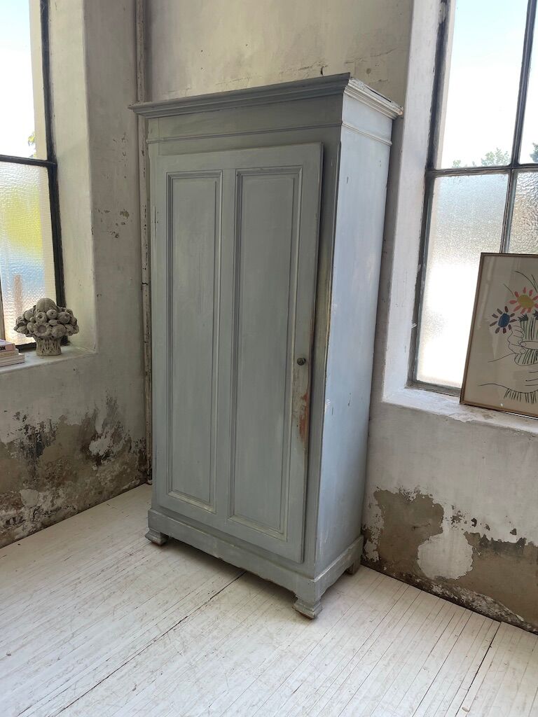 Blue patinated cap cabinet