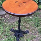 Pedestal table with inlaid top and flower decoration