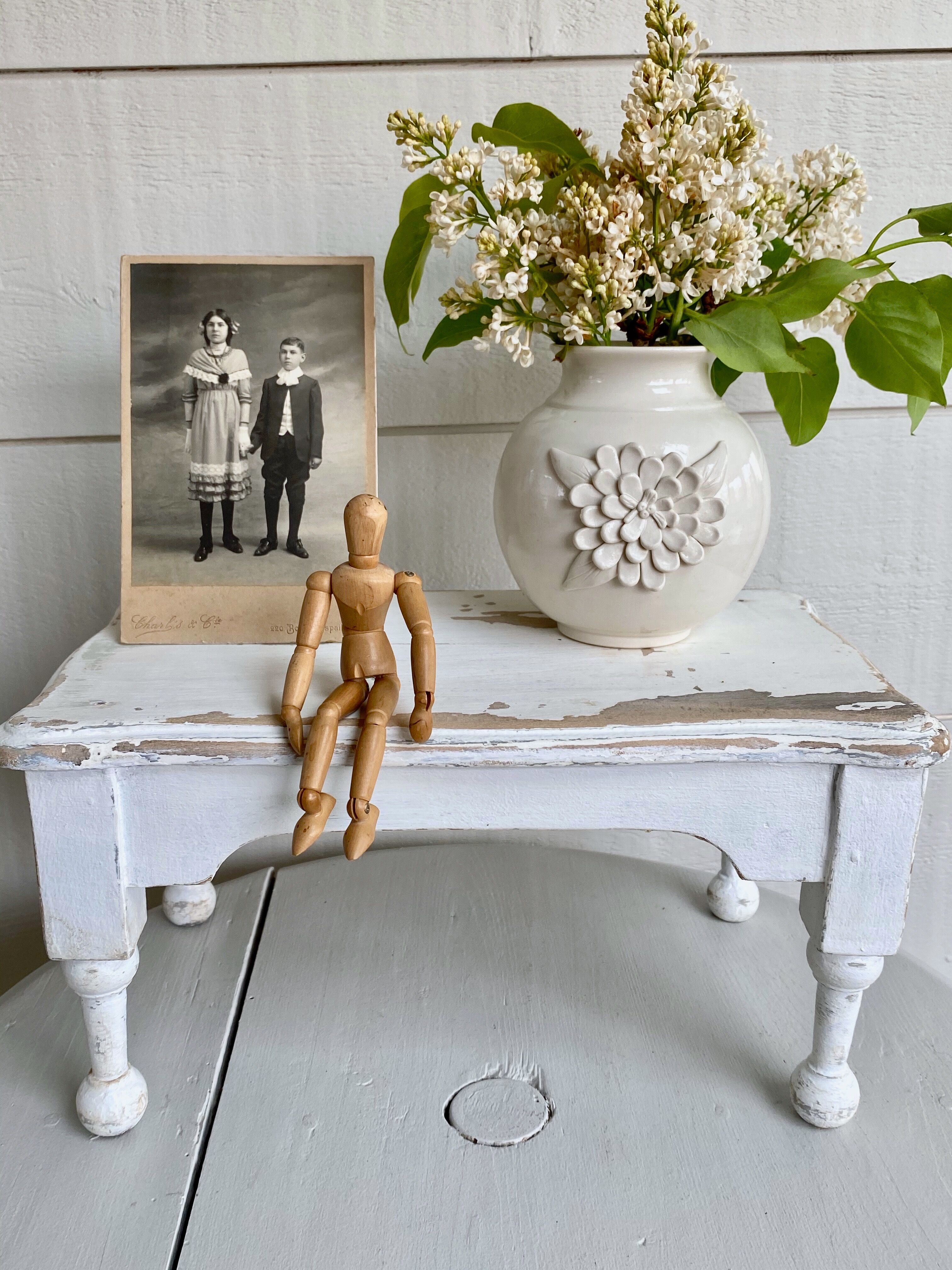 Small ceramic vase with floral relief