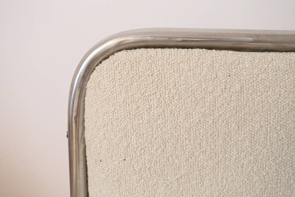 Armchair in ecru wool and stainless steel