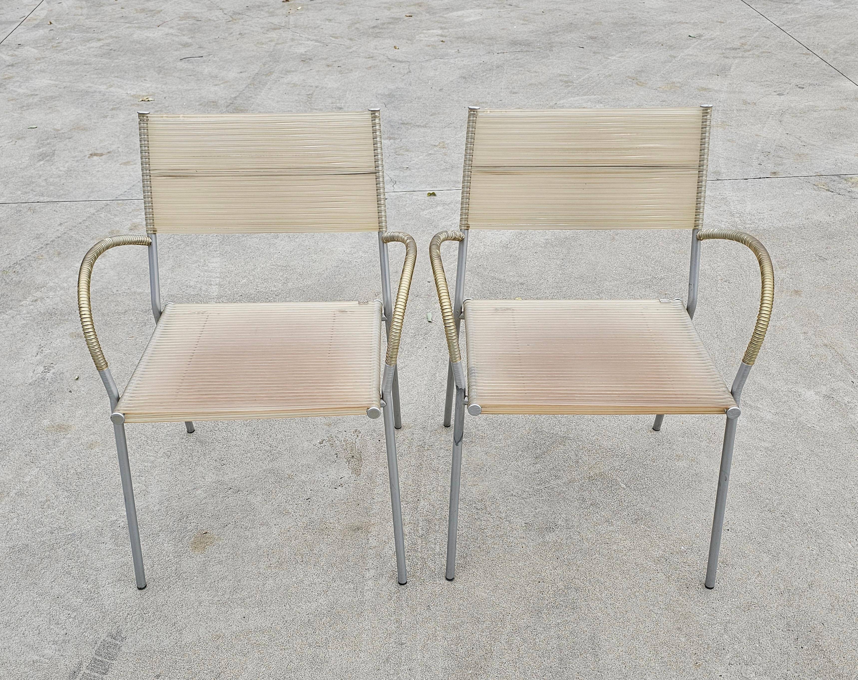 Set of 4 Miss B dining chairs by Tito Agnoli for Bonacina, 1990s.