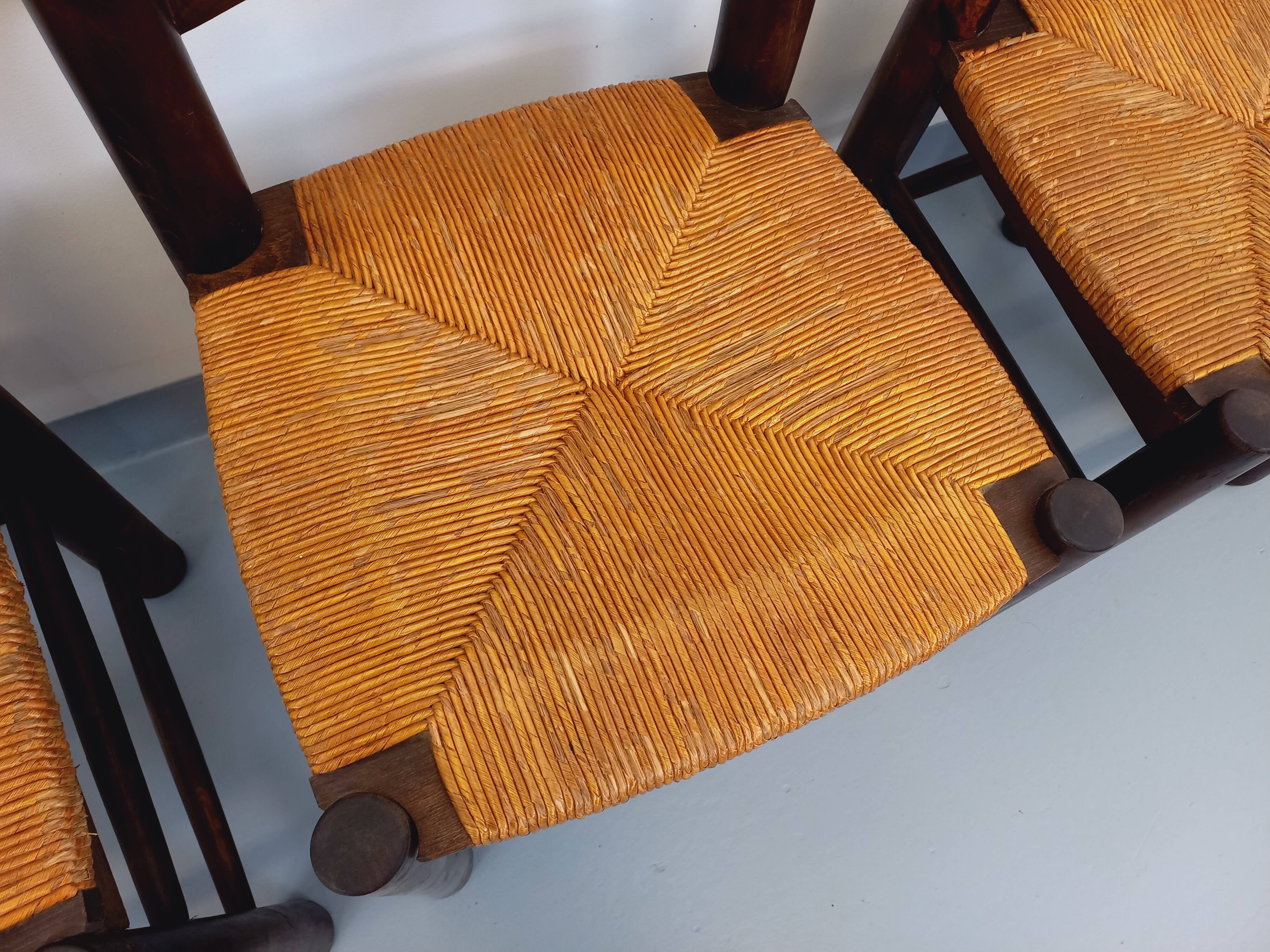 Set of 4 vintage brutalist chairs by Georges Robert in wood and straw.