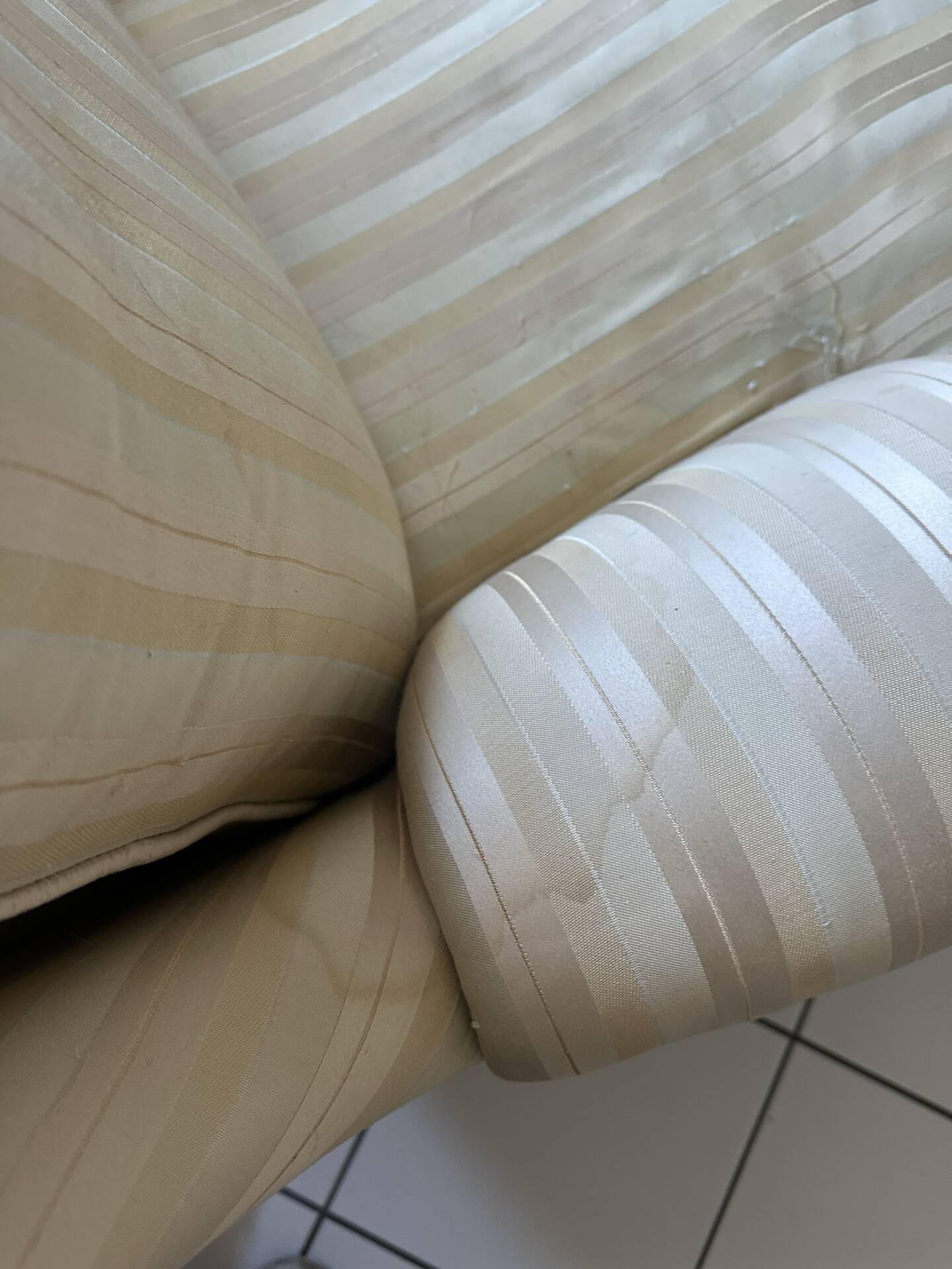 Pair of vintage bergère armchairs in striped ecru and beige fabric.