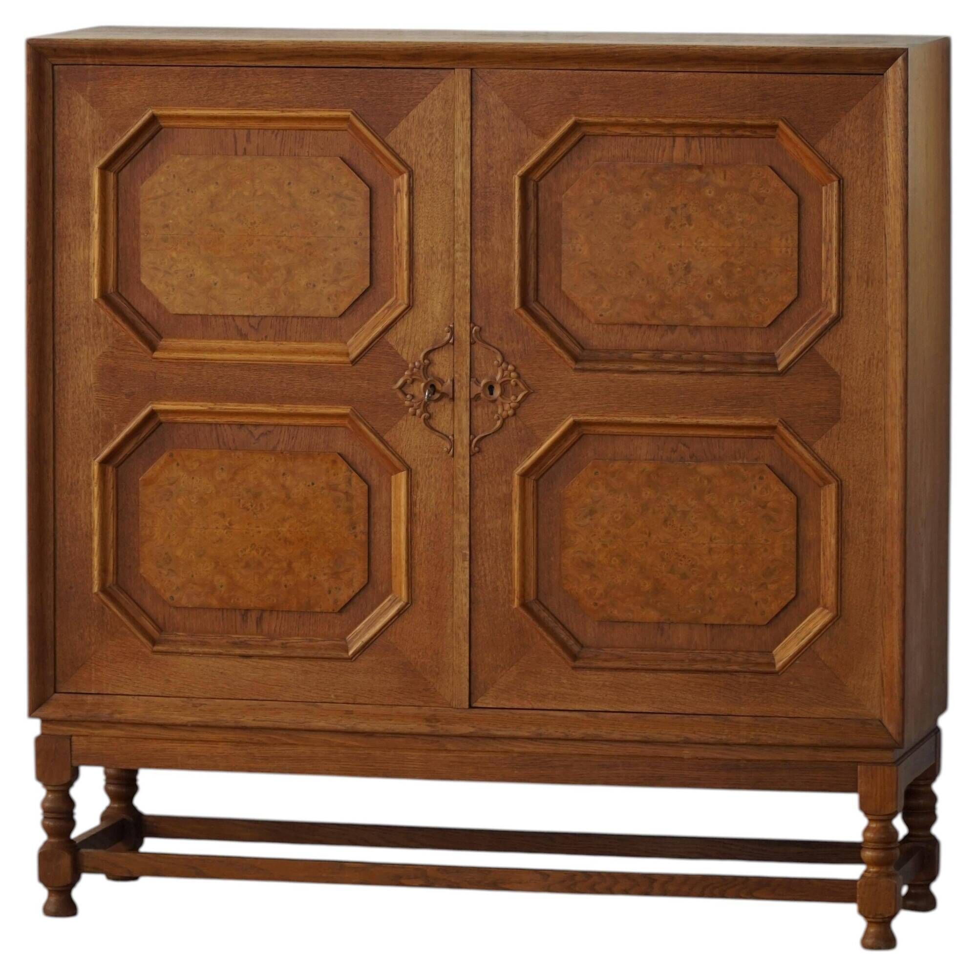 Classic sculptural Danish wardrobe in oak veneer and burl wood, 1950s.